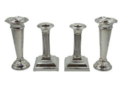 Pair of silver dwarf column candlesticks by Ellis & Co