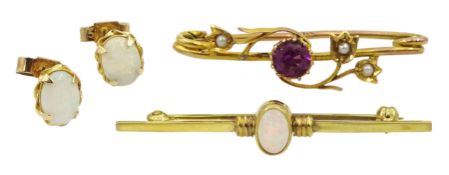 Pair of gold oval opal stud earrings