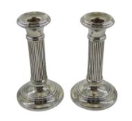 Pair of silver column candlesticks by Napper & Davenport