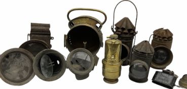A collection of vintage motorcycle and cycle lamps.