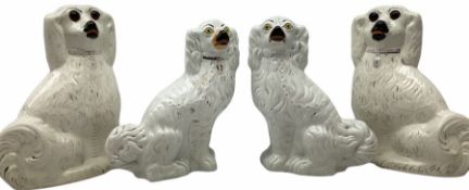 A pair of large 19th century Staffordshire dogs with glass eyes