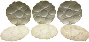 Set of six Minton white glazed oyster dishes