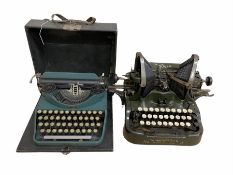 The Oliver Typewriter model no. 9 together with a portable typewriter by Royal Typewriter Co. in car