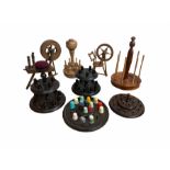 A group of 20th century turned wood thimble and bobbin stands