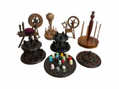 A group of 20th century turned wood thimble and bobbin stands