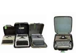 Four vintage portable typewriters comprising Blue Bird