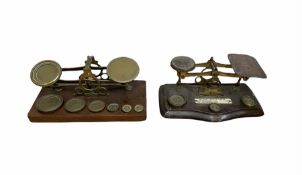 Two sets of 19th/ early 20th century brass postal scales with weights