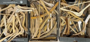 Quantity of early 20th century and later wooden advertising coat hangers including Grey & Wilkinson