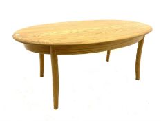 Ercol light elm oval coffee table