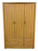 Solid light oak triple wardrobe with four drawers