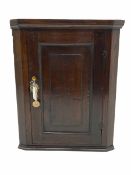 18th century oak corner cabinet enclosed by single fielded panel door