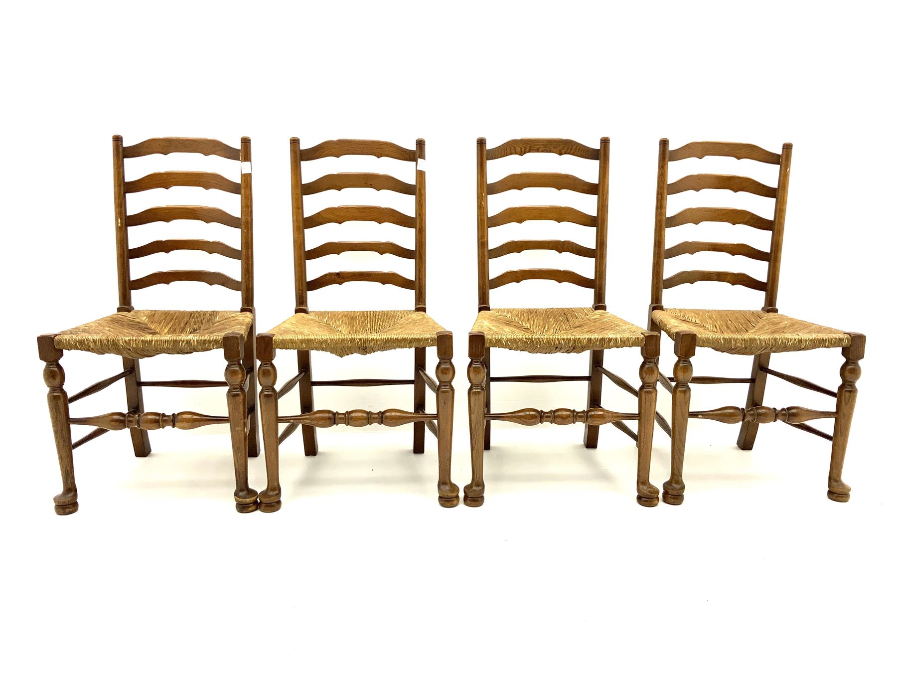 Light oak drop leaf dining table and four ladder back chairs with seats