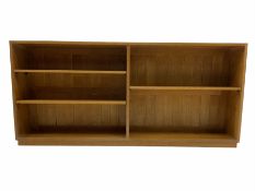 Light oak low two sectional open bookcase fitted with adjustable shelves