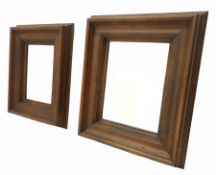 Two dark oak framed wall mirrors