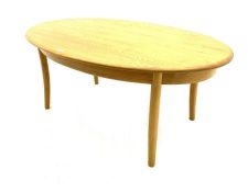 Ercol light elm oval coffee table