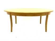 Ercol light elm oval coffee table