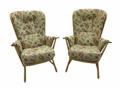 Pair of Ercol light beech easy armchairs with upholstered loose cushions