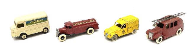 Dinky - four unboxed and playworn die-cast commercial vehicles comprising early Type 2 Petrol Tank W