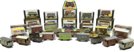 Graham Farish '00' gauge - twenty-two plastic goods wagons in various design boxes; and twenty unbox