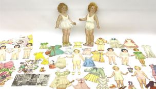 Two 37cm Shirley Temple cut-out paper and plywood dolls for dressing; and a quantity of other smalle