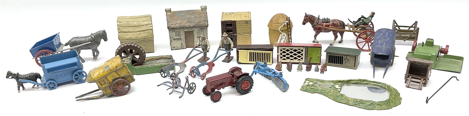 Lead figures and die-cast farm accessories including F.G. Taylor thatched cottage and rabbit hutch w