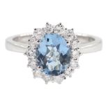 18ct white gold oval aquamarine and round brilliant cut cluster ring