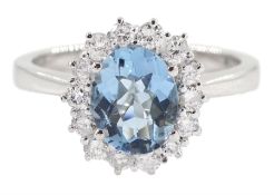 18ct white gold oval aquamarine and round brilliant cut cluster ring