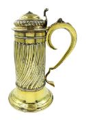 Georgian silver-gilt wine flagon with spiral ribbed body scroll handle and hinged cover