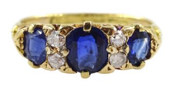 Early 20th century three stone oval sapphire and four stone diamond ring