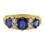 Early 20th century three stone oval sapphire and four stone diamond ring