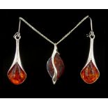 Pair of silver amber pendant earrings and a silver amber pendant necklace