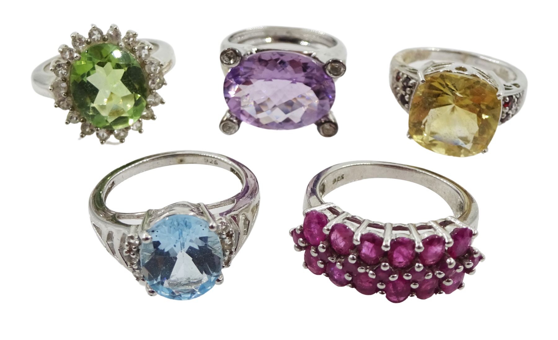 Five silver stone set rings including amethyst and white topaz