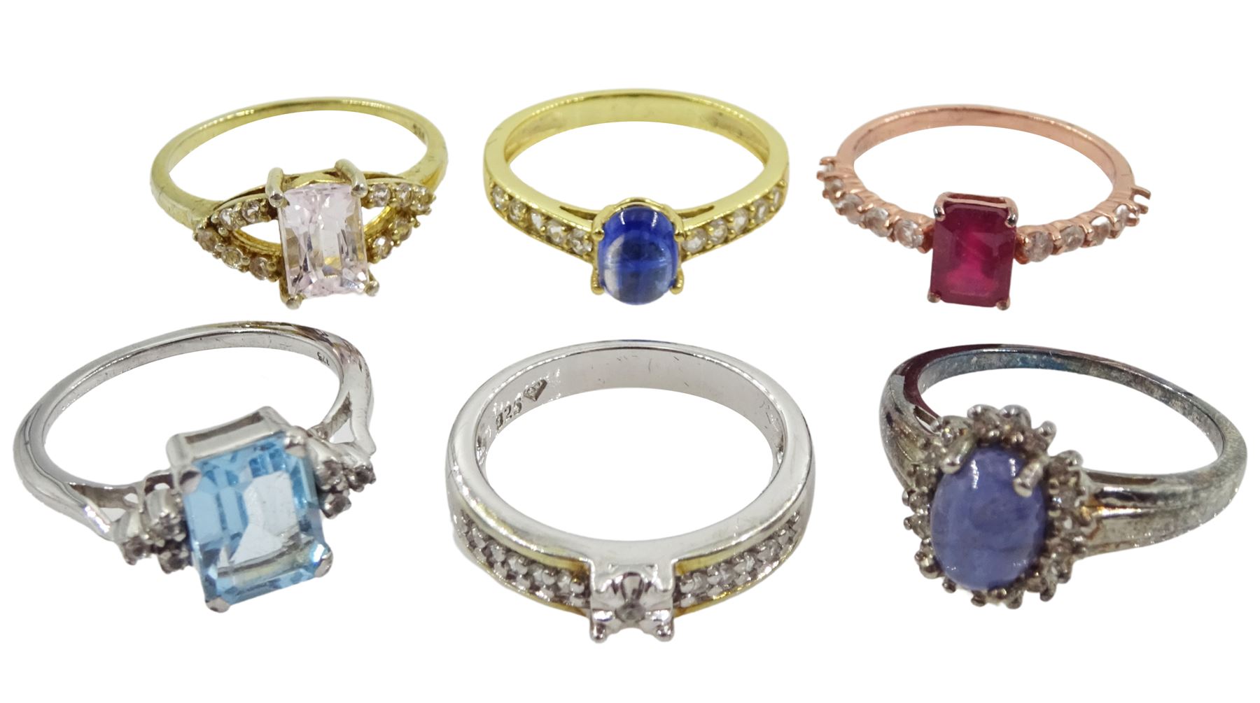 Six silver and silver-gilt stone set rings including ruby and topaz