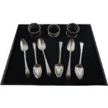 Set of six Georgian teaspoons and three silver napkin rigs
