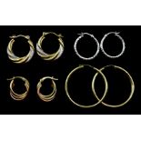 Four pairs of 9ct white and yellow gold hoop earrings