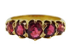 Early 20th century 18ct gold graduating five red stone set ring