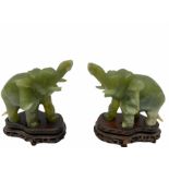 Pair jade figures modelled as elephants with trunks raised