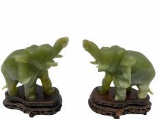 Pair jade figures modelled as elephants with trunks raised