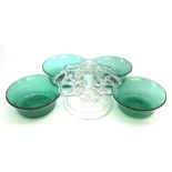 Set of four early 19th century Bristol green glass finger bowls