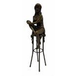 Art Deco style bronze modelled as a female holding her knee in her hands