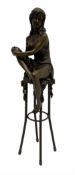 Art Deco style bronze modelled as a female holding her knee in her hands