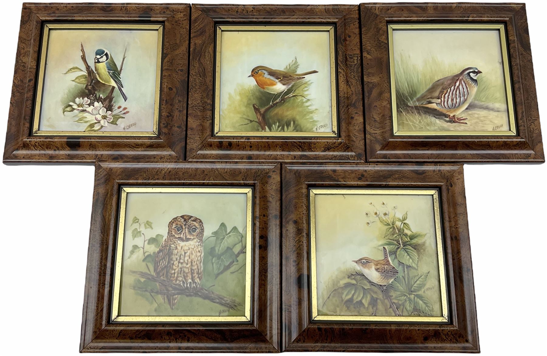 Five framed porcelain plaques