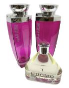 Two 'Desire' by Alfred Dunhill factice display perfume bottles of tapering form and a 'L'Uomo' by Tr