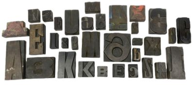 Various Vintage woodblock letter stamps.