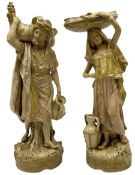 Pair of Royal Dux figures modelled as Persian male and female water carriers