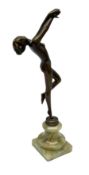 Art Deco style bronzed figure of a nude female balancing on her right foot upon onyx plinth