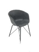 Bucket chair upholstered in stone grey fabric on outsplayed supports