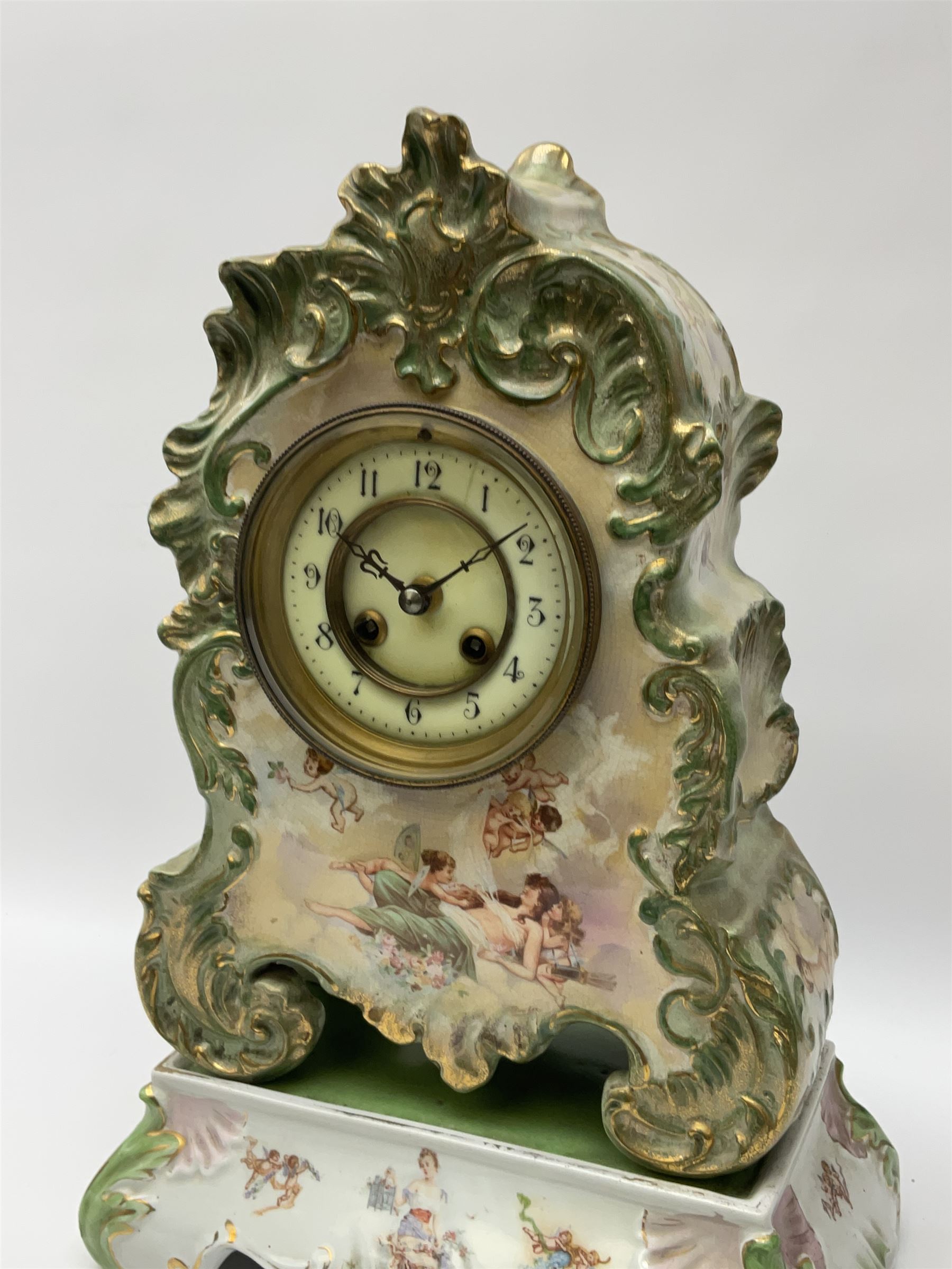 An early 20th century French porcelain clock with rococo scrolling in a cartouche form with gilt hig - Image 5 of 5