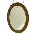 Oval gilt framed wall mirror