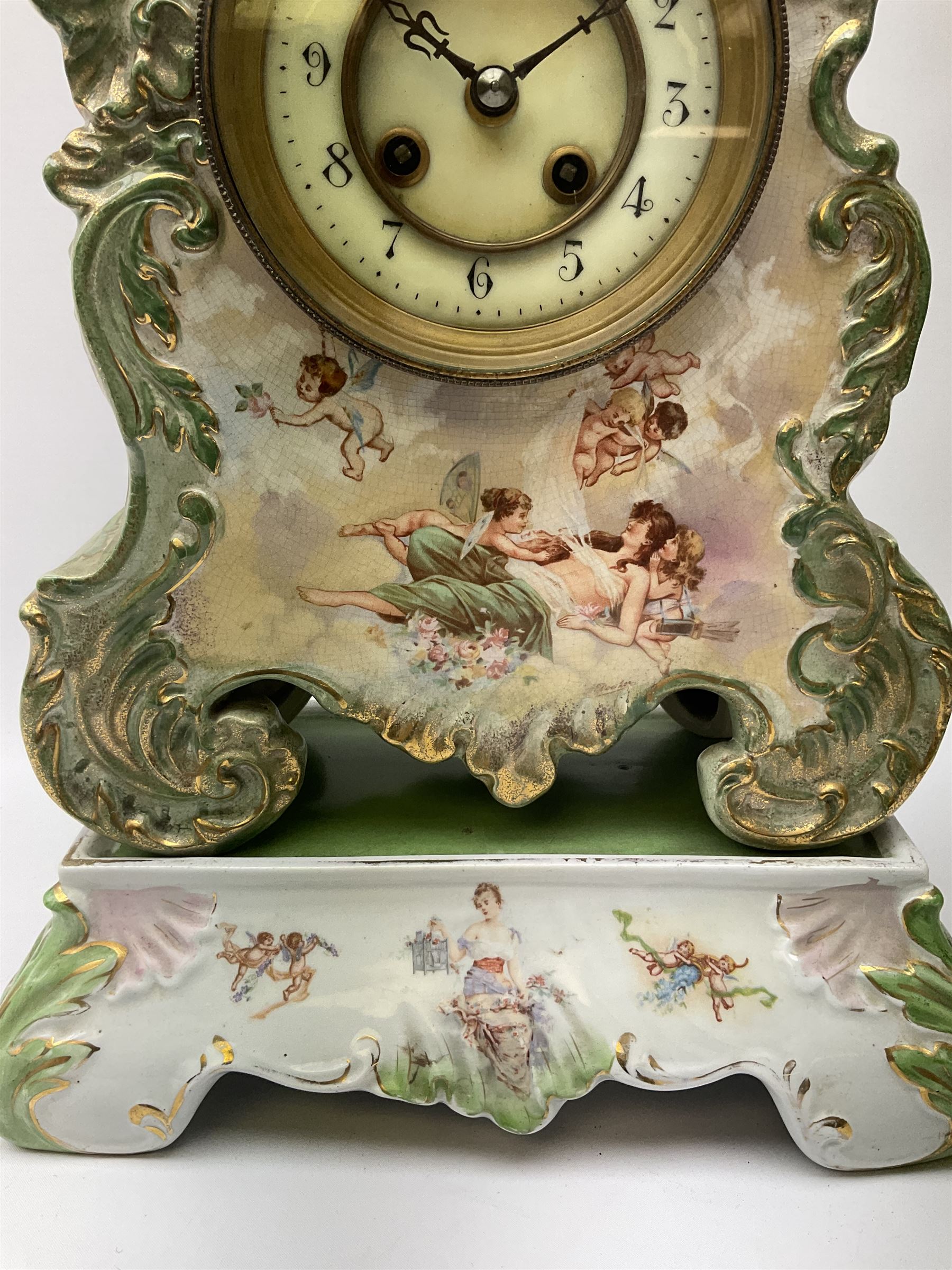 An early 20th century French porcelain clock with rococo scrolling in a cartouche form with gilt hig - Image 4 of 5